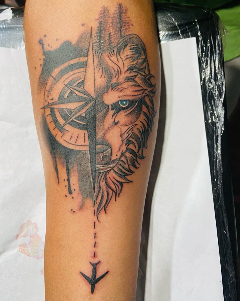 Strength & direction half compass half wolf forearm tattoo