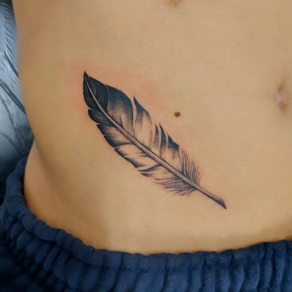 Striking black & grey eagle feature tattoo on the side of the stomach