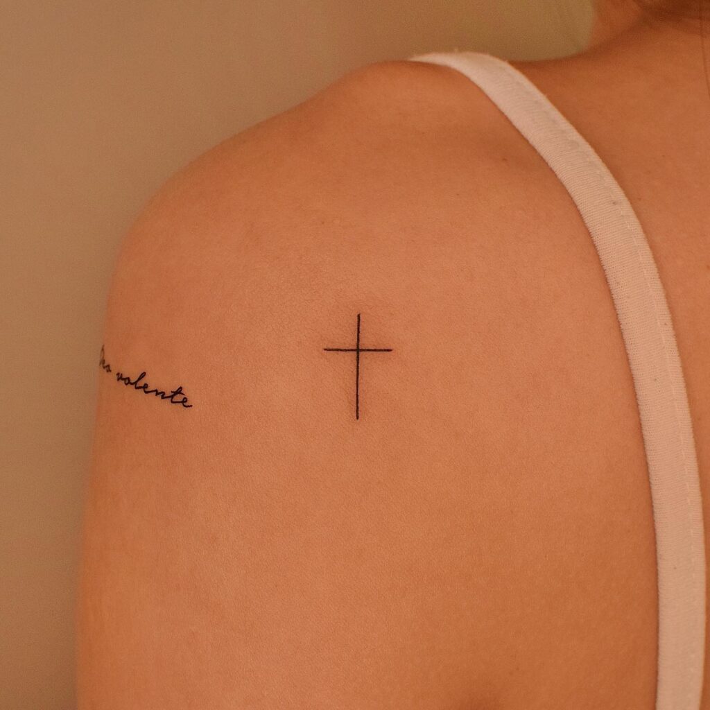 Stunning back of shoulder small simple cross tattoo female