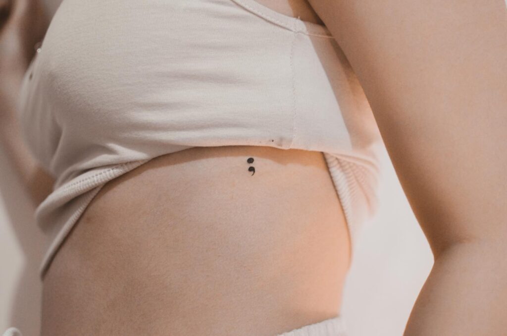 Stunning Semicolon Tattoo, an Elegant Choice: Rib Symphony