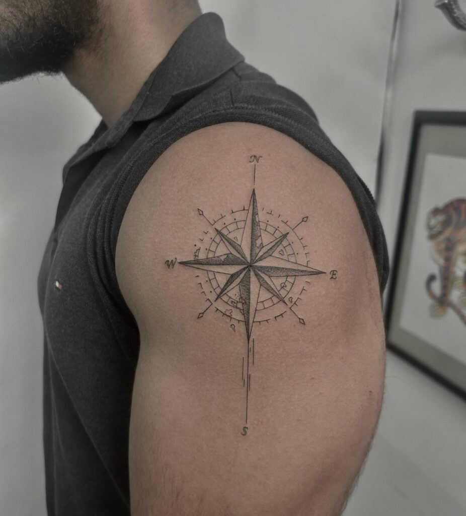 Stylish Fineline Compass Tattoo on the Upper Arm for Men: Fineline North