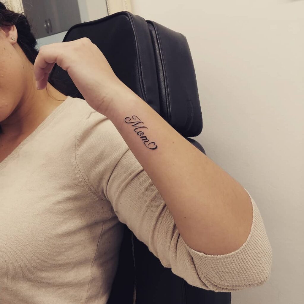 Stylish mom script wrist tattoo embrace love with stylish outlined script design