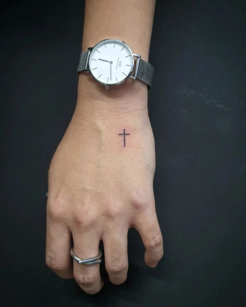 Stylish small cross tattoo hand tattoo men wrist