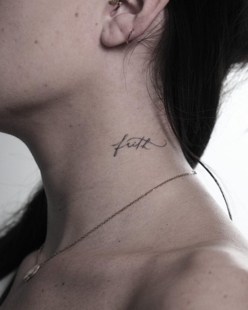 Stylish Tiny 'Faith' Lettering in Black Ink on the Side of the Neck: Faithful Chic