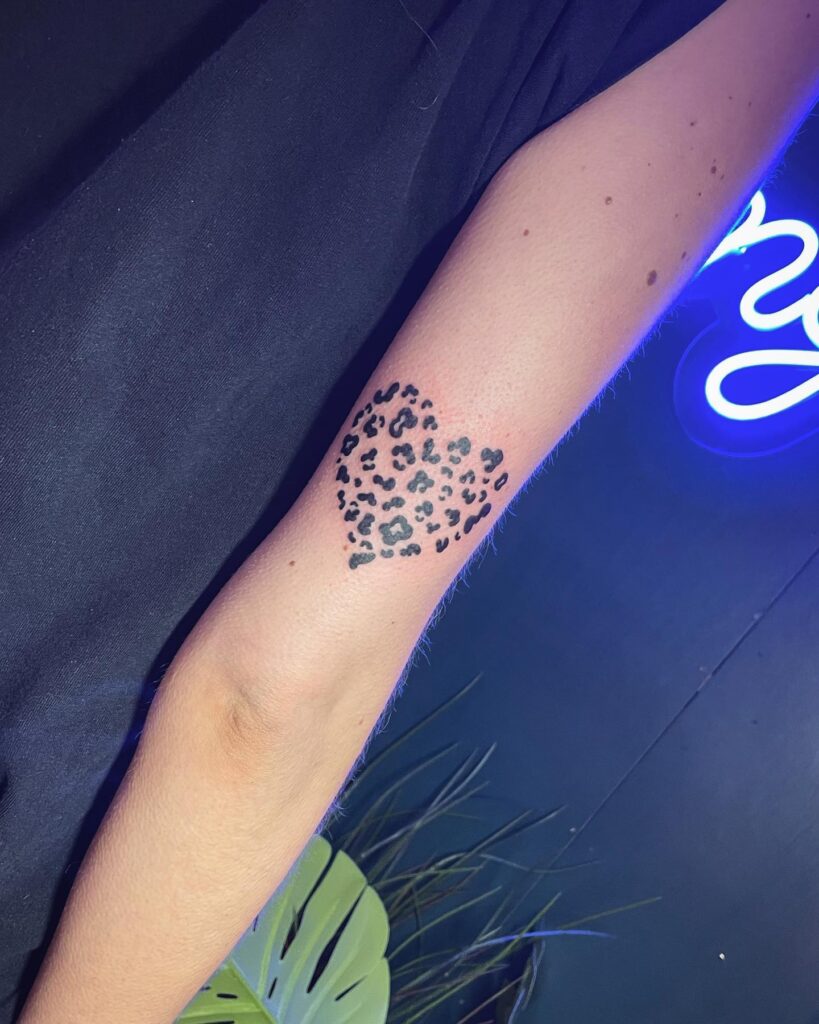 Subtle Feminine Charm Small Leopard Print Heart Tattoo on Arm with image