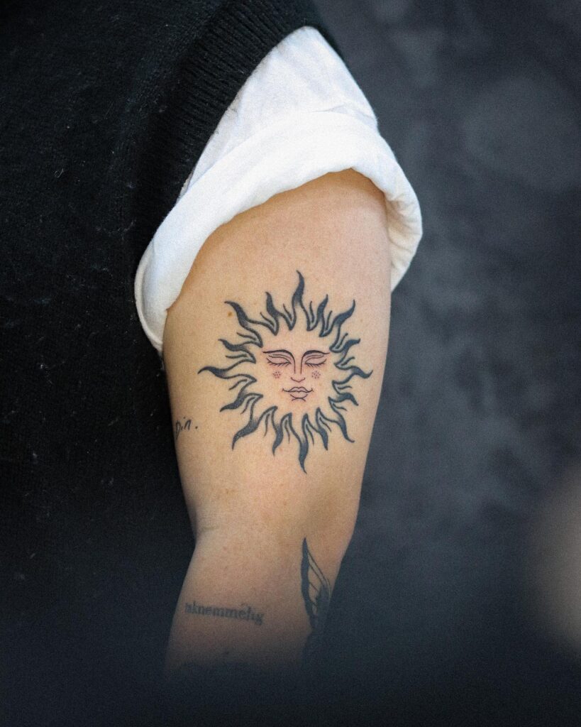 Sun Tattoo on Upper Arm Radiant Symbolism