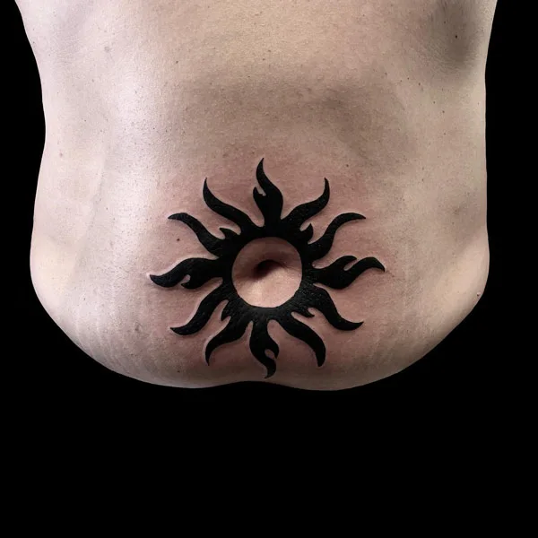 Sun belly button tattoo