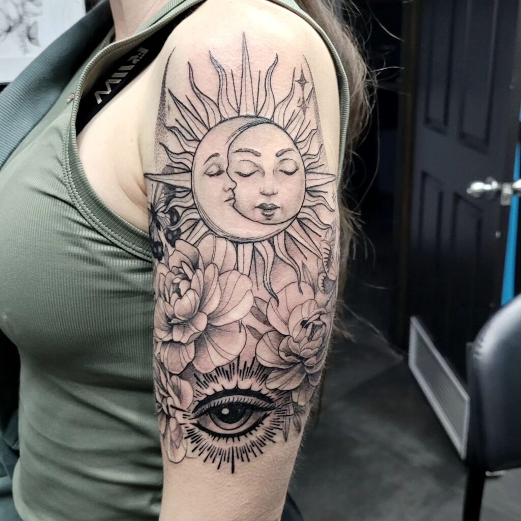 Sun, Moon, Eye, and Flower Tattoo Half Sleeve: Feminine and Symbolic Ink