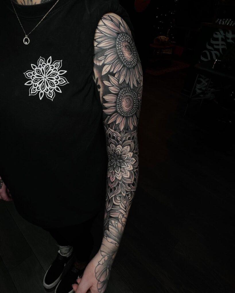 Sunflower tattoo sleeve with mandala and dotwork shading