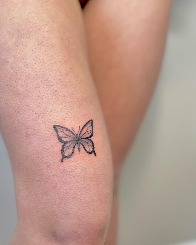 Super cute little butterfly tattoo on the front thigh dainty flutter