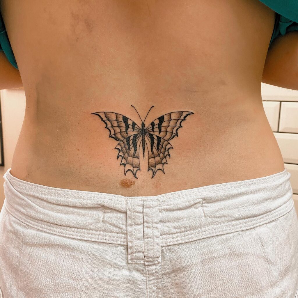 Swallowtail Butterfly Tattoo on the Lower Back: Flight of Freedom