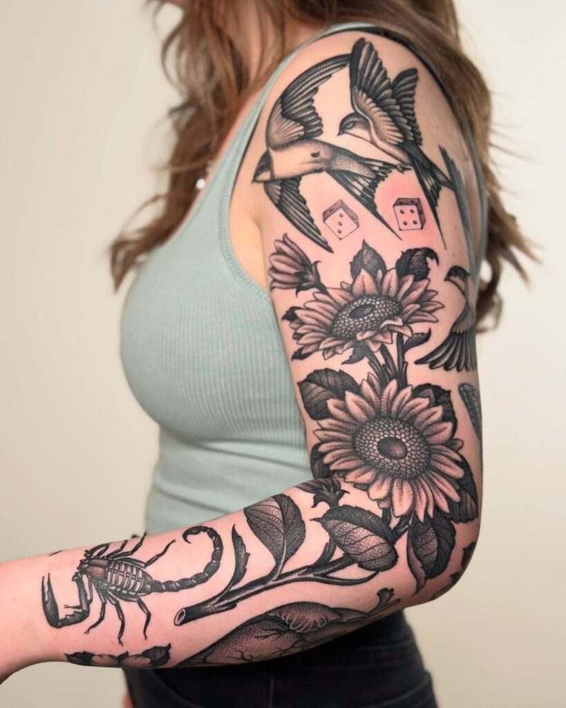 Symbolic Blackwork Tattoo Sleeve with Sunflowers, Swallows, and a Scorpion