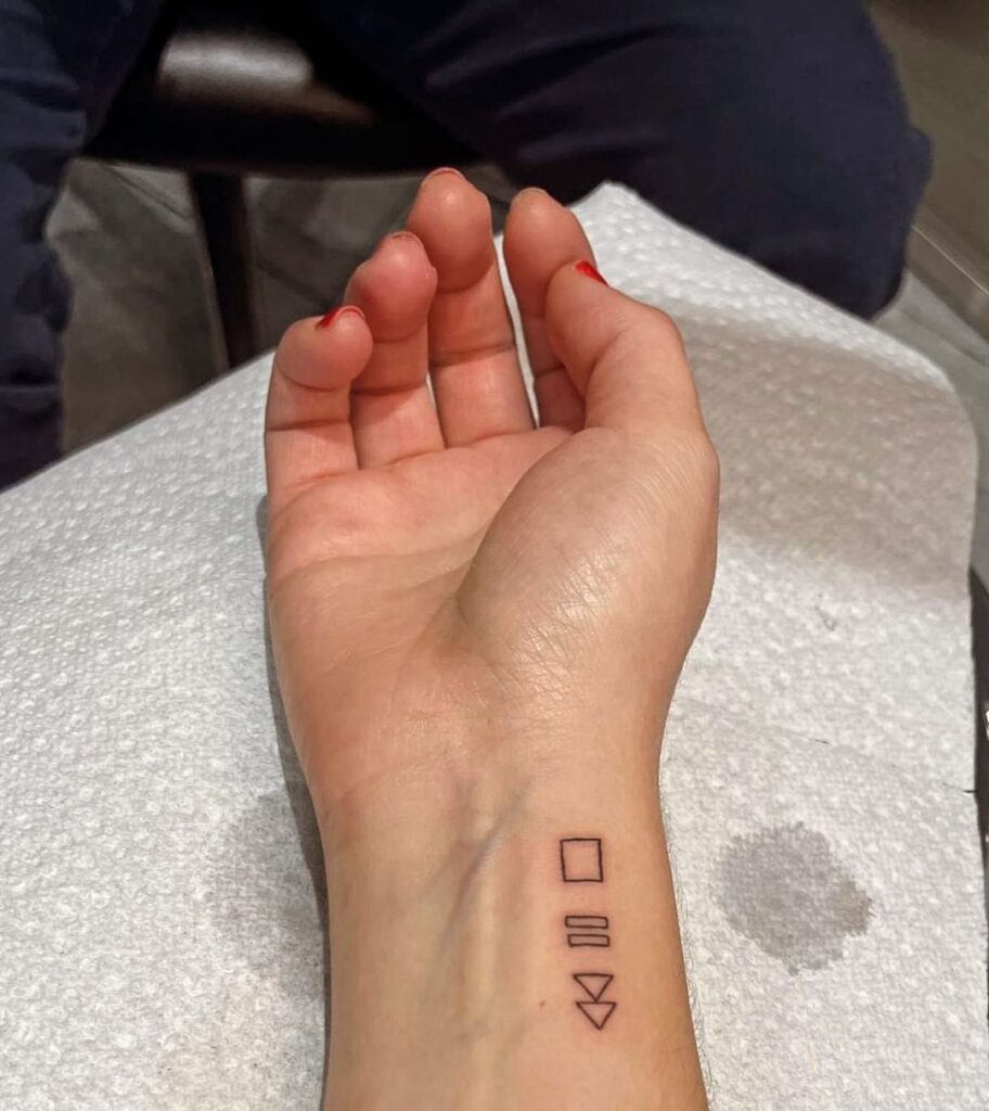 Symbolic inner wrist tattoo stop pause play embrace the power of meaningful ink