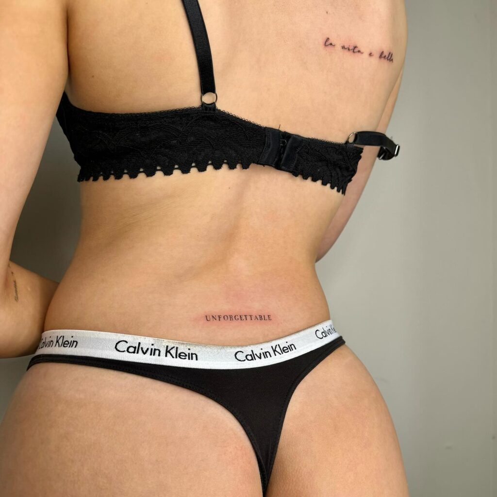 Text Lettering Tattoo on the Lower Back: Unforgettable Whispers