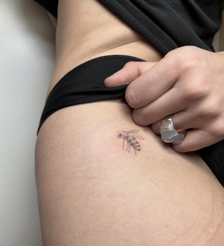 The cutest bee tattoo on the hip for women hip honeybee