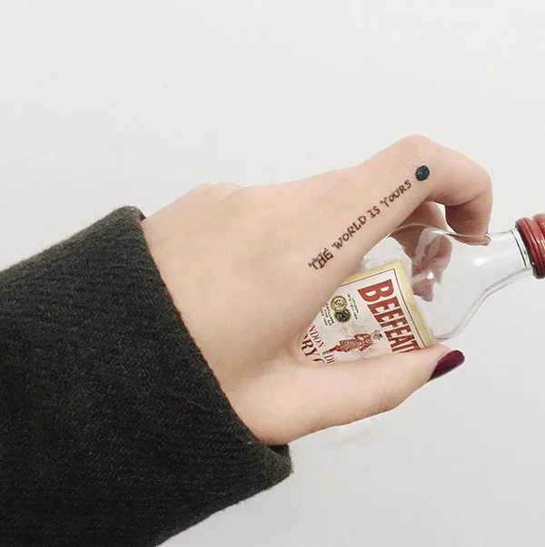 The world is yours finger tattoo