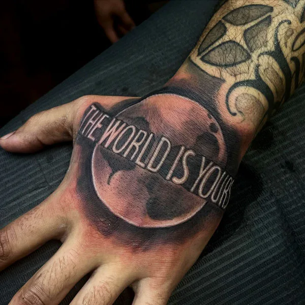The world is yours hand tattoo