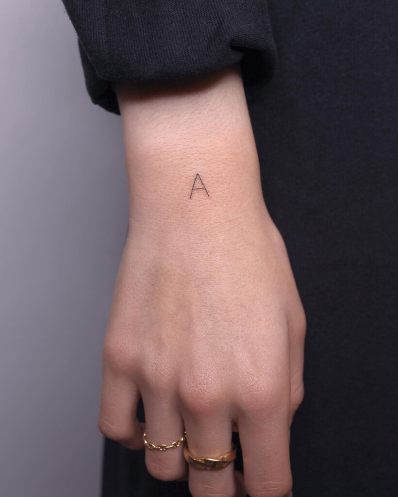 Thick Fineline A Tattoo on the Outer Wrist a Simple Yet Striking Personal Statement Bold Initials