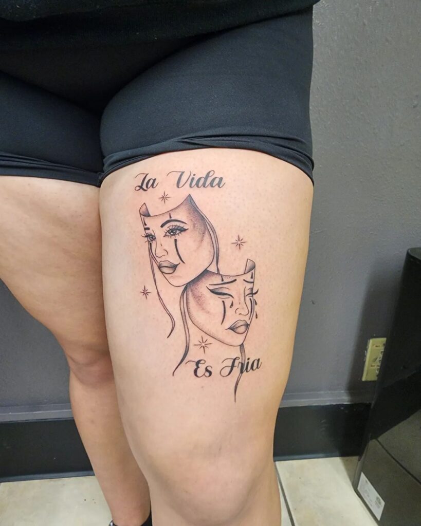 Thigh Tattoo La Vida Es Fria Script with Laugh Now Cry Later Masks 