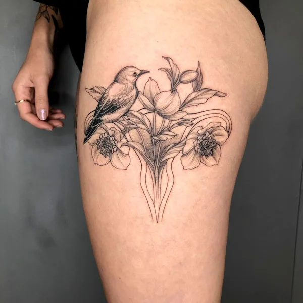 Thigh womb tattoo