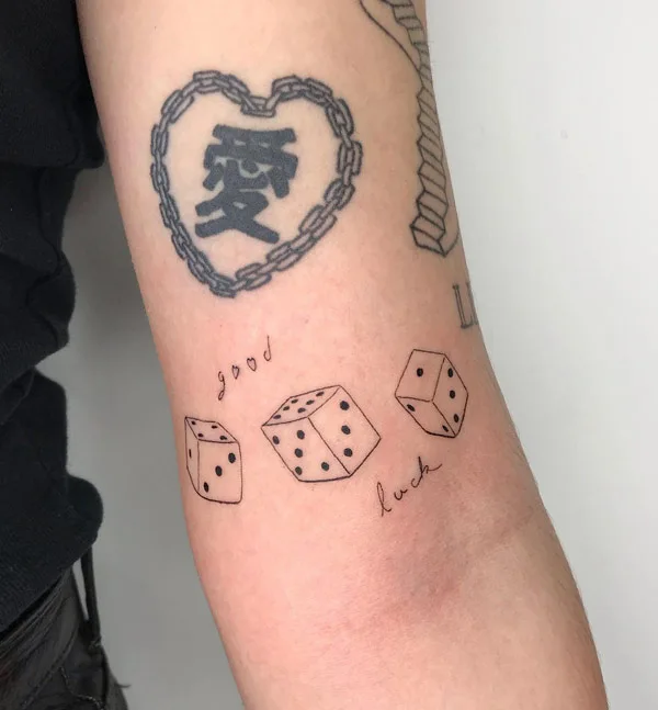 Three dice tattoo