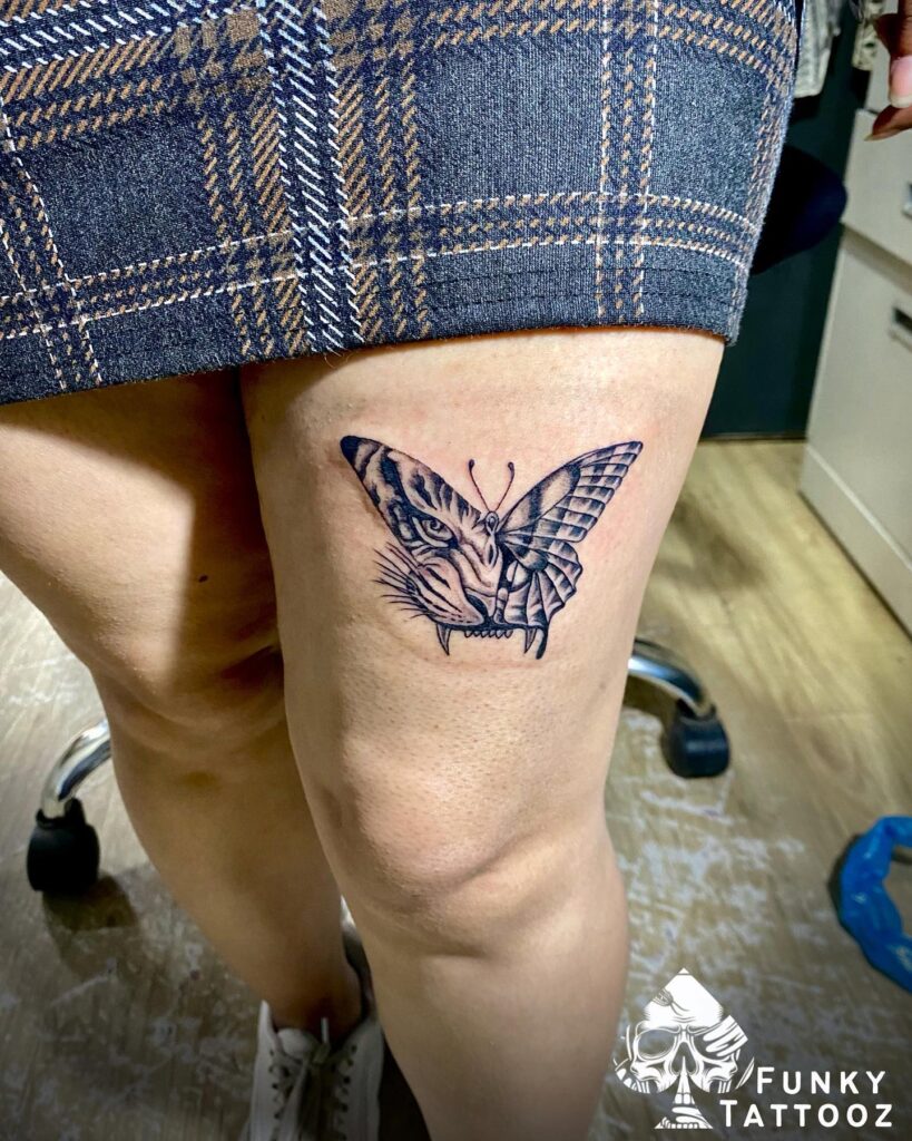 Tiger and butterflies graceful thigh tattoo for women