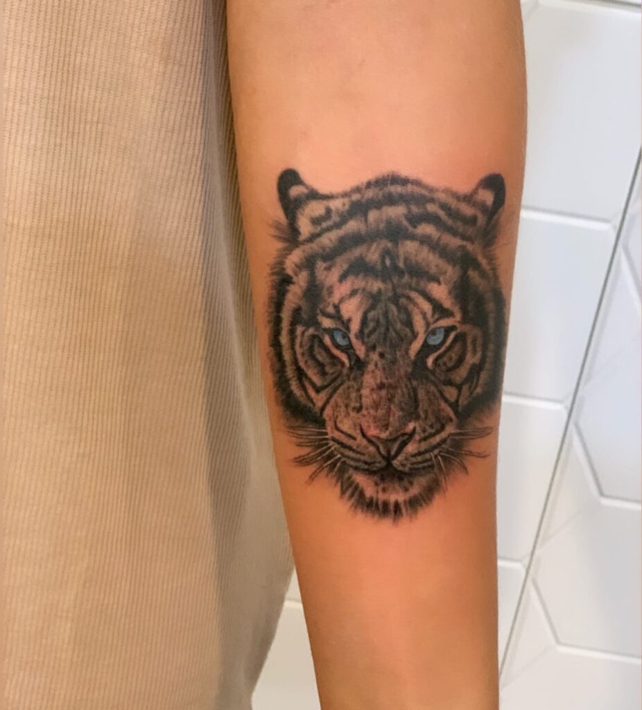 Tiger face forearm tattoo for females