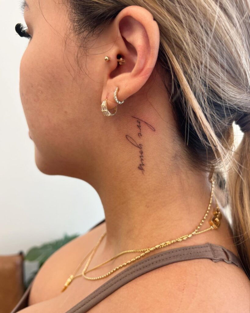 Tilted word art on the side neck for a unique perspective 'love yours' script whimsy