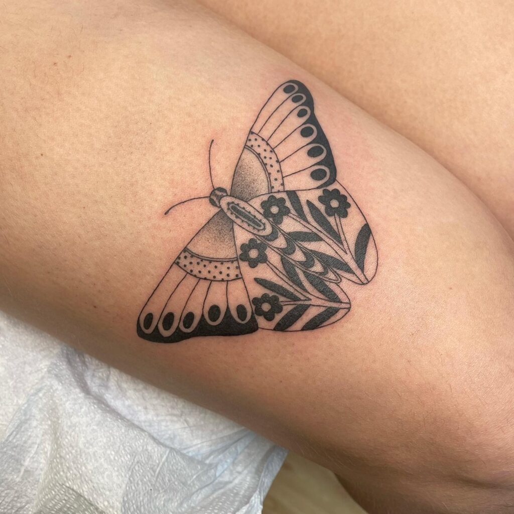 Timeless beauty traditional butterfly thigh tattoo