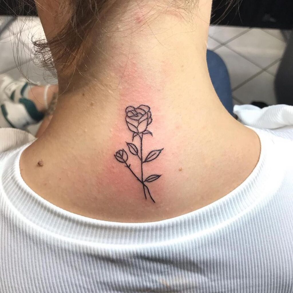 Timeless elegance small rose outline tattoo on the back of the neck