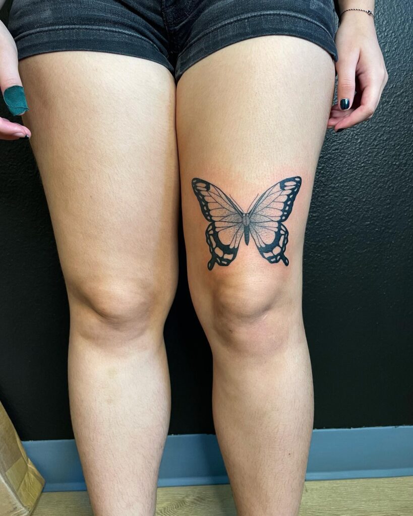 Timeless grace black and grey traditional butterfly tattoo on thigh