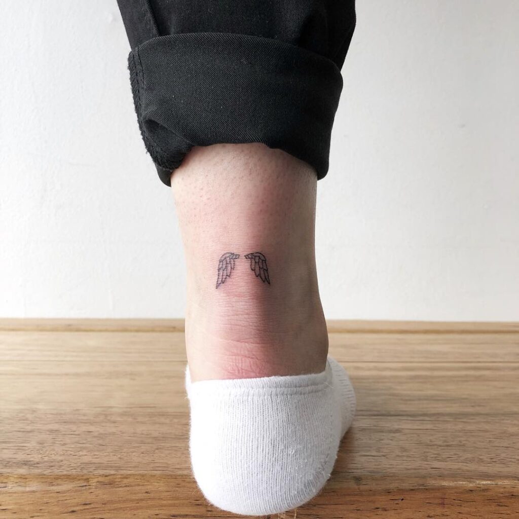 Tiny Angel Wings Tattoo Back of the Ankle: Dainty Ascent