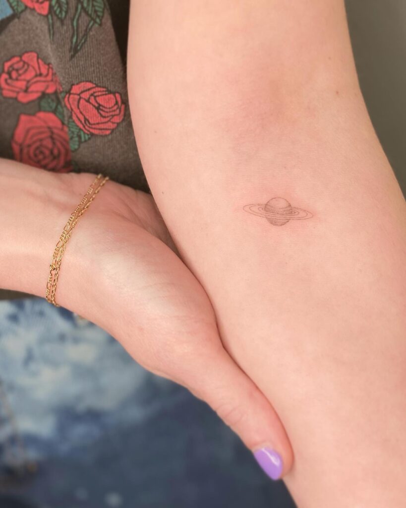 Tiny Below the Elbow Tattoo, a Cosmic Accent: Saturn Whispers