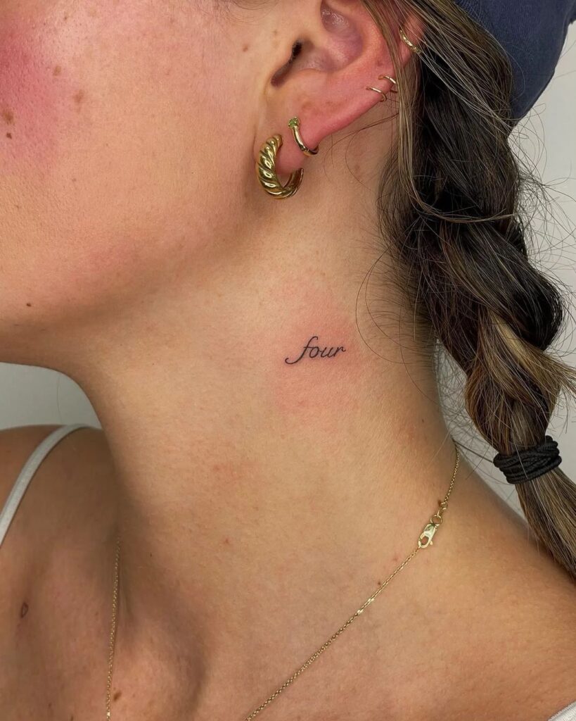 Tiny 'four' lettering tattoo on the side neck numeric elegance