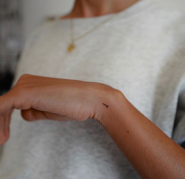 Tiny 'i' Letter Tattoo on the Side: Wrist Whispers