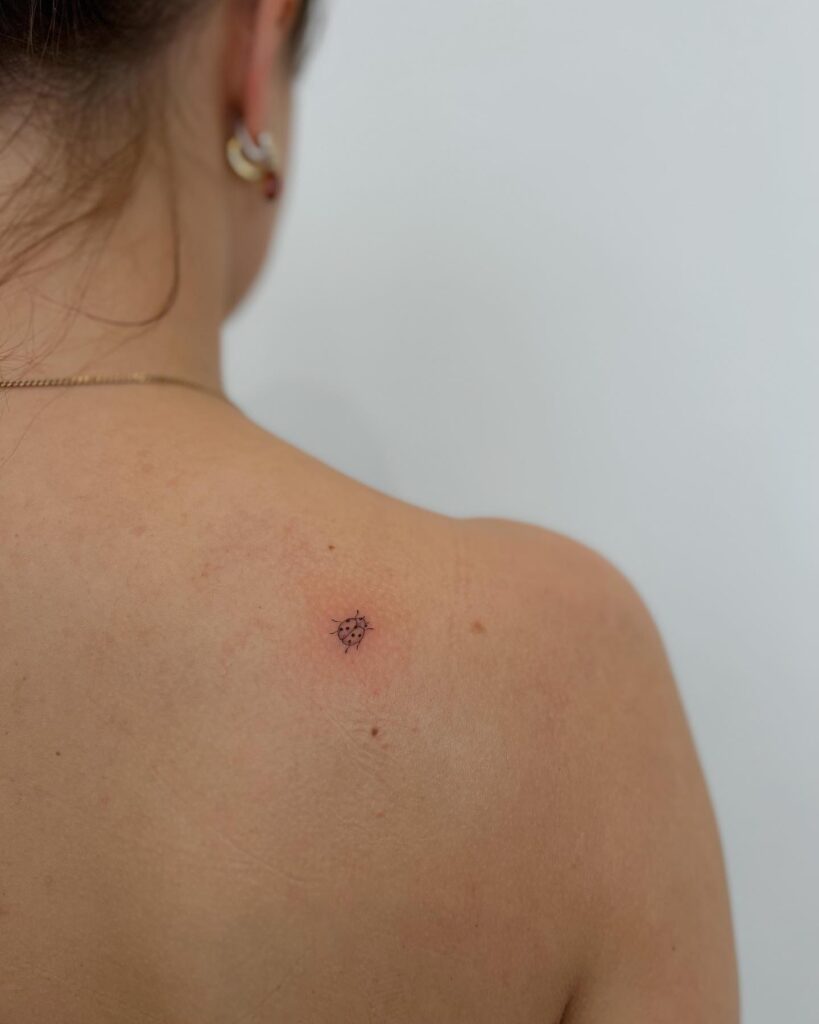 Tiny Ladybug Back of Shoulder Tattoo: Shoulder Charm