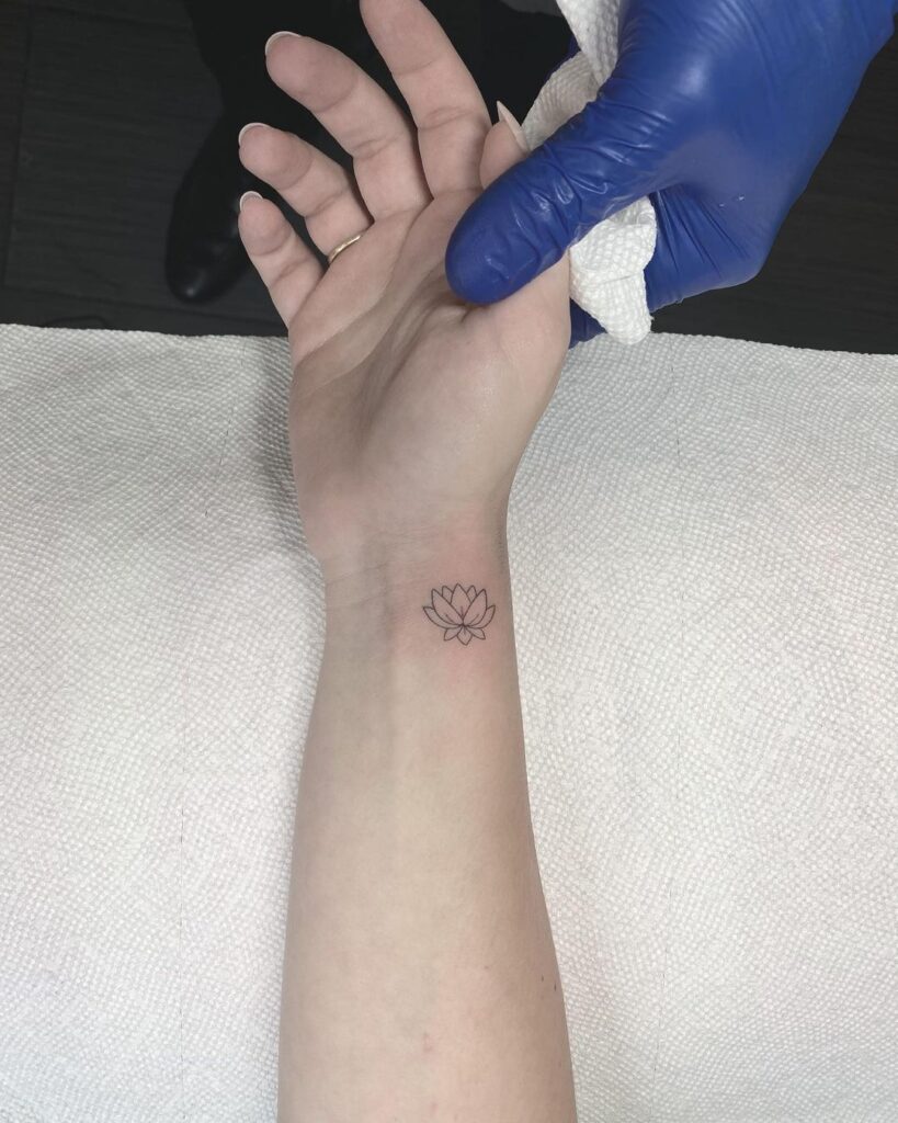 Tiny lotus tattoo on the inner wrist for females wrist whispers