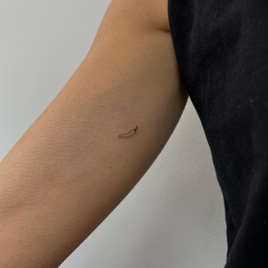 Tiny Pepper Tattoo on the Inner Arm, a Small Outline Beauty: Subtle Spice