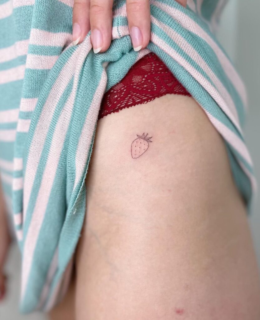 Tiny Strawberry Side Hip Tattoo for Females: Sweet Hip Strawberry