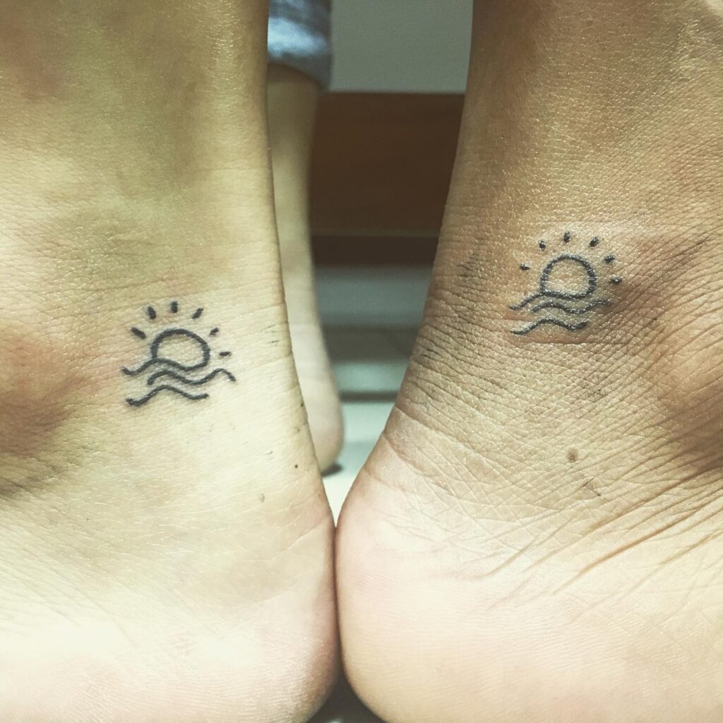 Tiny Sun And Wave Tattoo On The Ankle