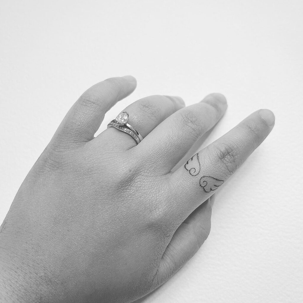 Tiny Tattoo on the Outer Index Finger for a Subtle Touch: Finger Whispers