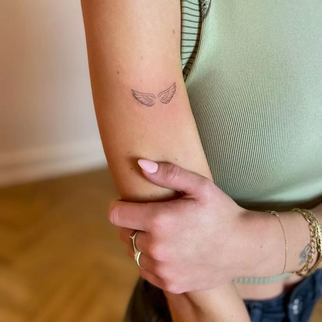 Tiny Wings Tattoo on the Elbow for a Subtle Statement: Elbow Grace