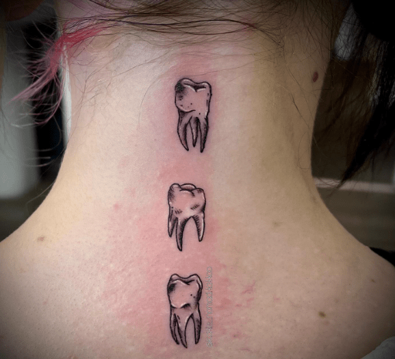 Tooth Tattoo Design on the Back of the Neck
