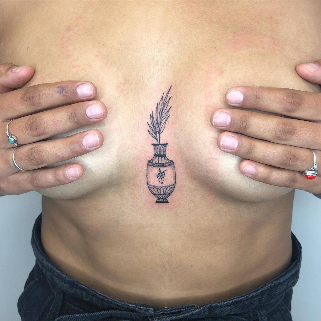 Traditional ornamental vase sternum tattoo meaning