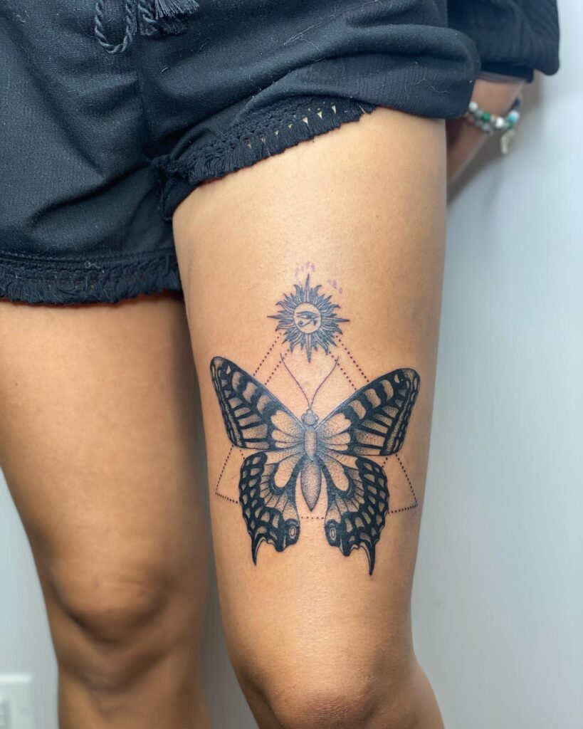 Embrace Elegance and Transformation with Trendy Above Knee Butterfly Tattoo Design
