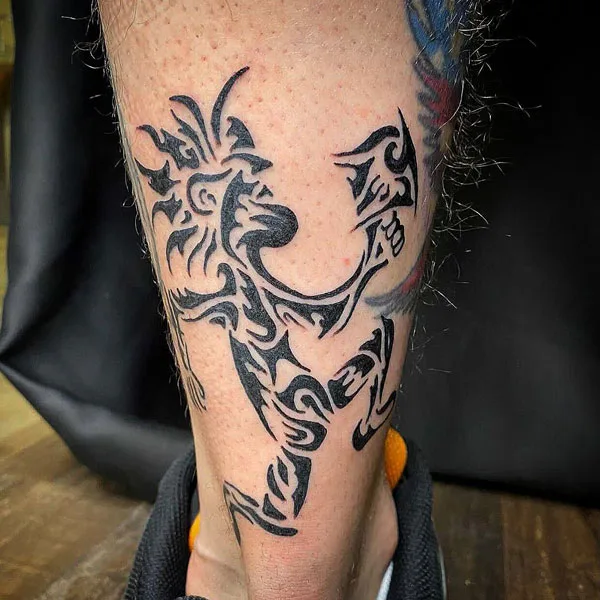 Tribal hatchet man tattoo