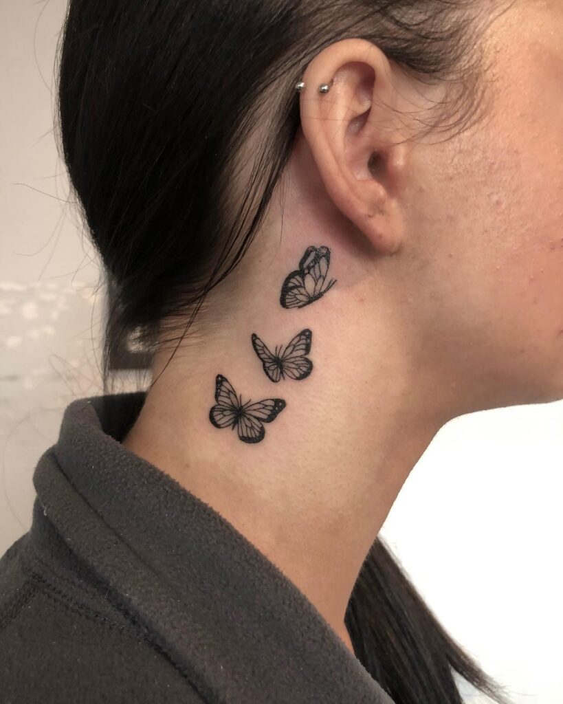 Triple beauty a trio of butterfly tattoos adorning the ears backside for females