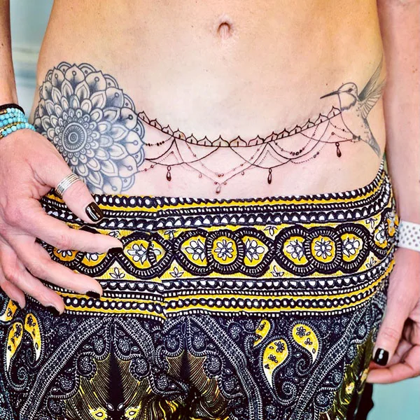 Tummy tuck scar tattoo 1