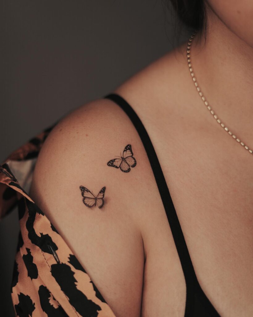 Two butterflies traditional shoulder tattoo: classic beauty in flight