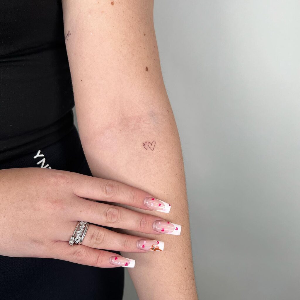 Two Handwritten Hearts Tattoo on the Below the Elbow, a Small and Endearing Pair: Love Duo